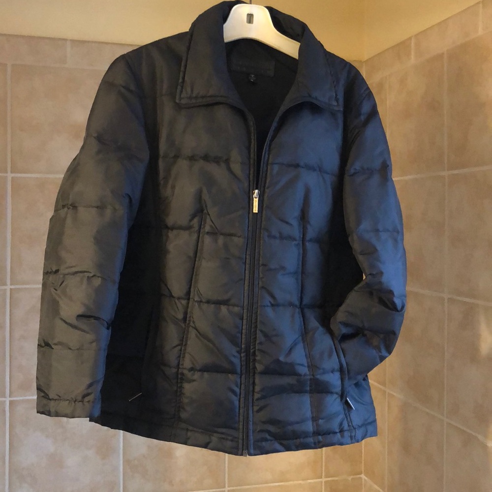 Black puffer jacket. NEVER worn!!